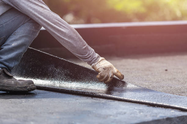 Professional Basement Waterproofing technician working in Island Park, NY